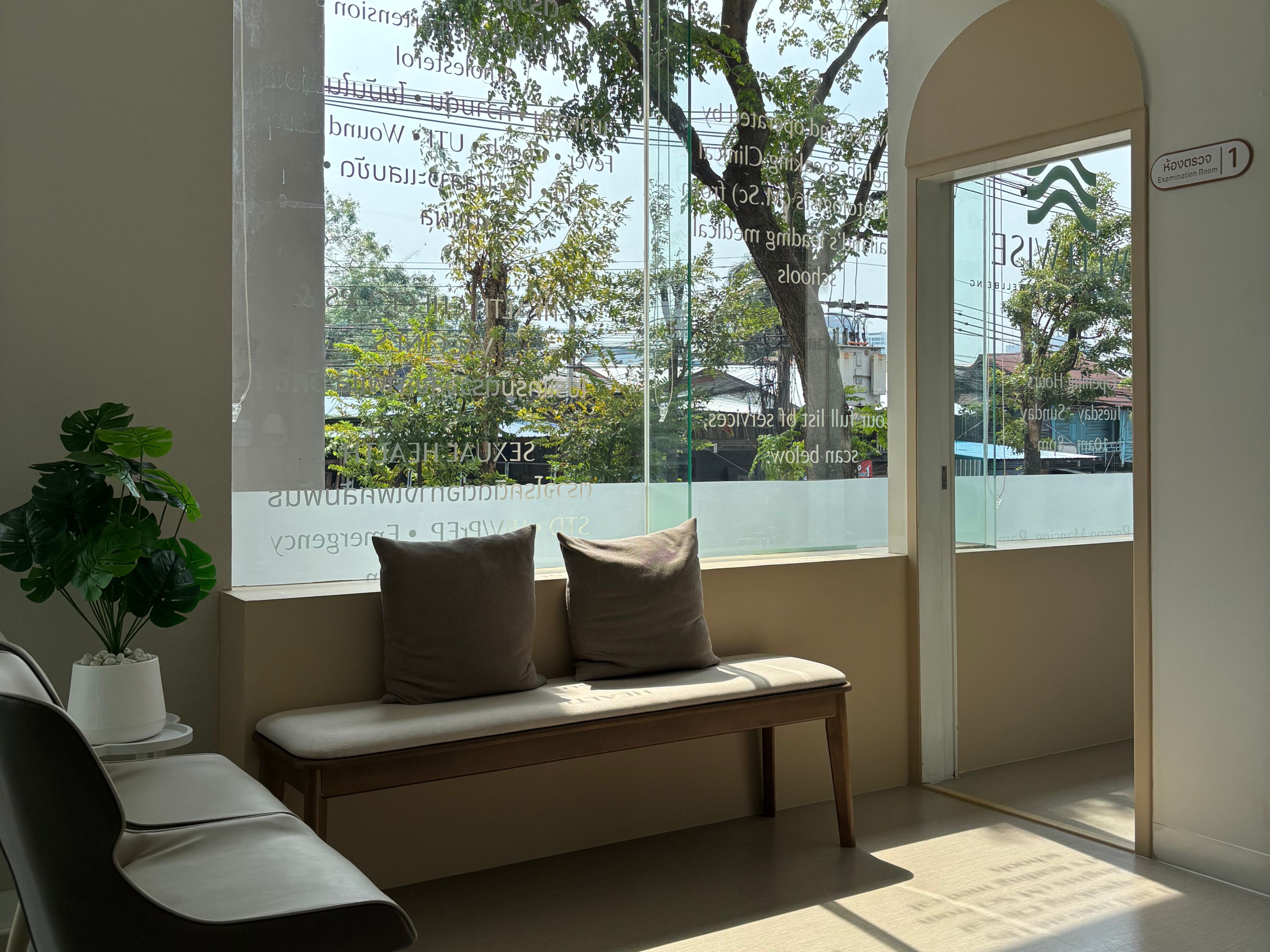 Calm, sage-toned treatment room at Wellwise Clinic